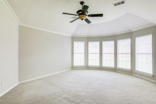 unfurnished room with baseboards, visible vents, crown molding, and light colored carpet