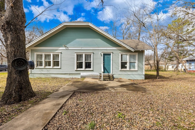 bungalow-style home with entry steps and a patio area