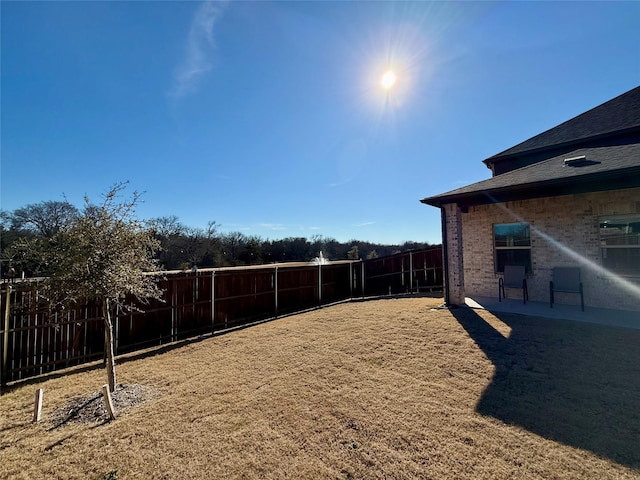 view of yard with a fenced backyard