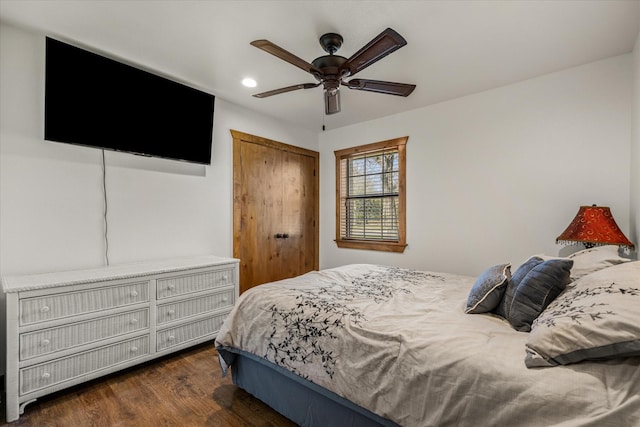 bedroom featuring a closet, a ceiling fan, dark wood-style flooring, and recessed lighting