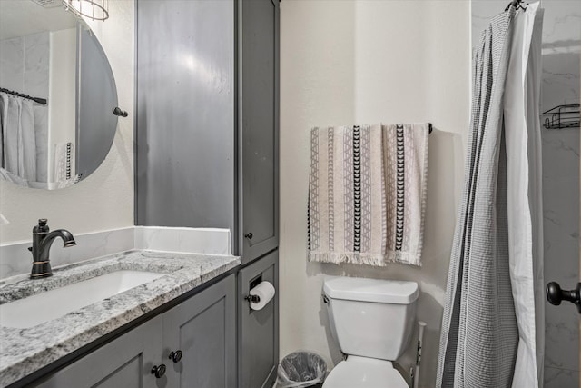 full bath featuring toilet, curtained shower, and vanity