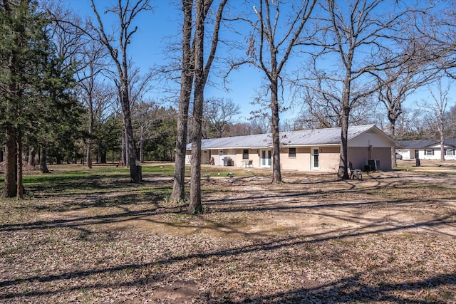 exterior space with metal roof