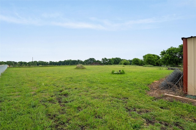 view of yard with a rural view