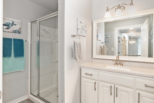 full bath featuring a stall shower and vanity