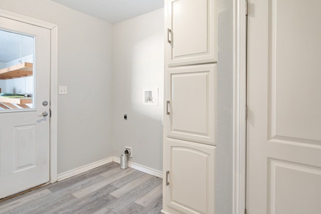 laundry area featuring laundry area, washer hookup, baseboards, light wood-type flooring, and electric dryer hookup