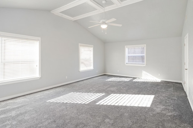 empty room with carpet floors, vaulted ceiling with beams, and a wealth of natural light