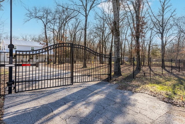 view of gate with fence