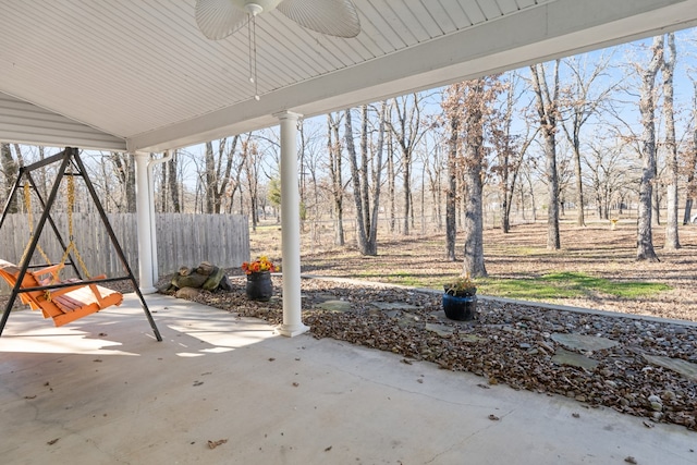 view of patio with a ceiling fan and fence