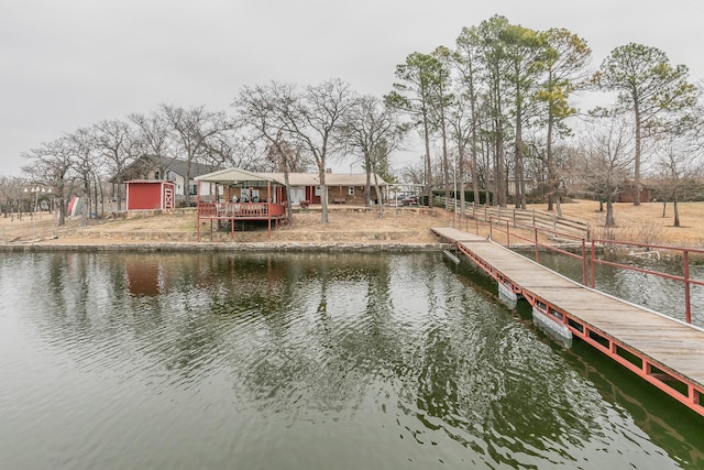 dock area featuring a gazebo and a water view