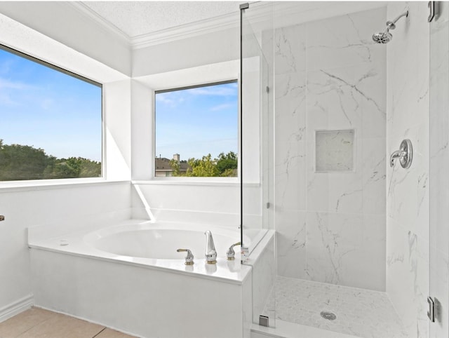 bathroom with plenty of natural light, a marble finish shower, a bath, and crown molding