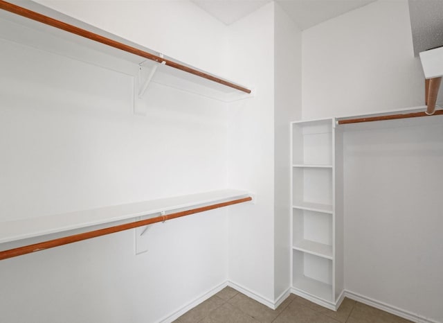 walk in closet featuring light tile patterned floors