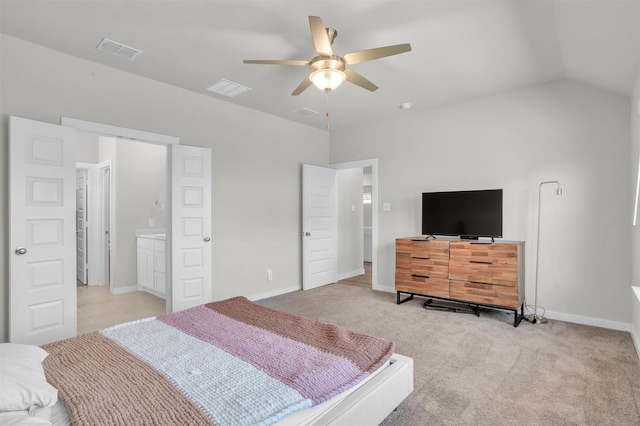 bedroom with ceiling fan, light colored carpet, visible vents, baseboards, and vaulted ceiling