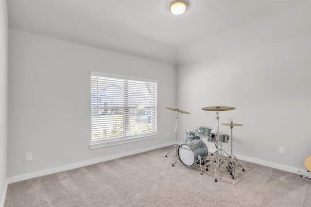 rec room featuring carpet floors and baseboards