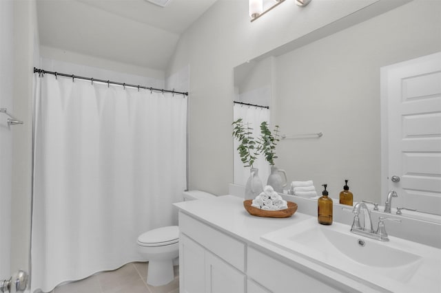 full bath with toilet, tile patterned flooring, lofted ceiling, and vanity