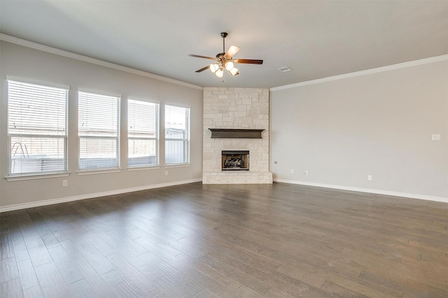 unfurnished living room featuring dark wood-type flooring, a ceiling fan, and crown molding