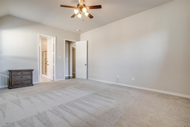 unfurnished bedroom featuring ceiling fan, carpet, and baseboards