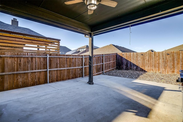 view of patio / terrace with a fenced backyard and a ceiling fan