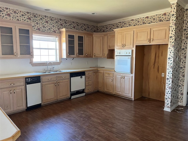 kitchen with white appliances, glass insert cabinets, dark wood-type flooring, light countertops, and a sink