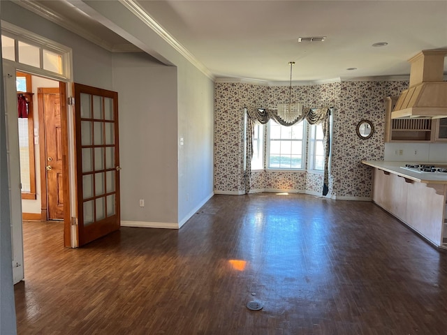 interior space featuring baseboards, visible vents, dark wood finished floors, ornamental molding, and a notable chandelier