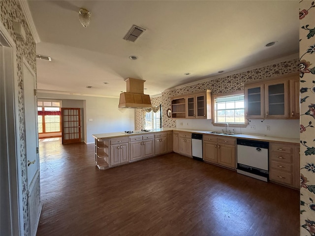 kitchen with a peninsula, white appliances, light countertops, and glass insert cabinets