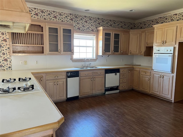 kitchen with white appliances, a sink, light countertops, custom exhaust hood, and glass insert cabinets