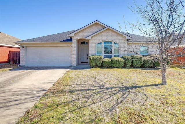 ranch-style home featuring an attached garage, brick siding, a shingled roof, driveway, and a front yard