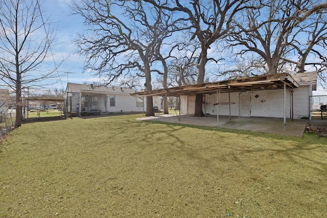 rear view of property with a patio, a lawn, and fence