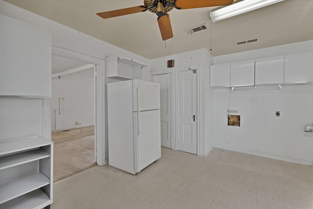 washroom with laundry area, washer hookup, visible vents, light floors, and electric dryer hookup