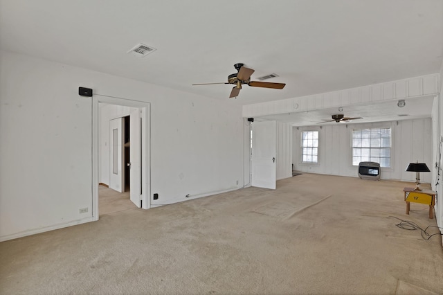 unfurnished room featuring visible vents and light colored carpet