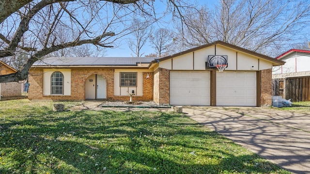 single story home with a garage, brick siding, a front lawn, and solar panels