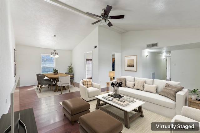 living room featuring lofted ceiling, visible vents, wood finished floors, and ceiling fan with notable chandelier