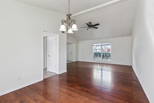 empty room with lofted ceiling, baseboards, wood finished floors, and ceiling fan with notable chandelier