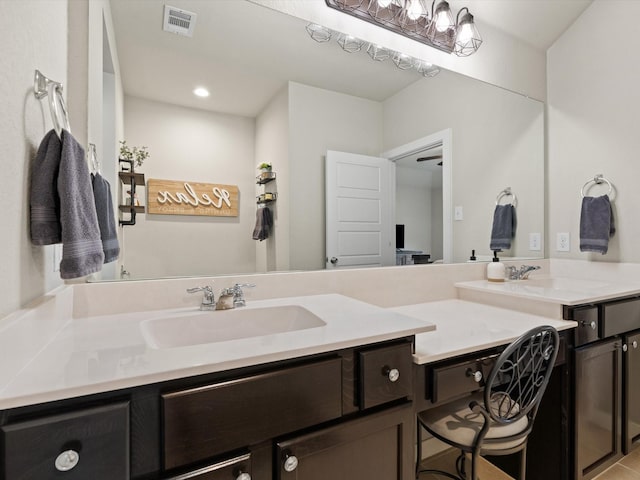 full bath featuring visible vents, a sink, and double vanity