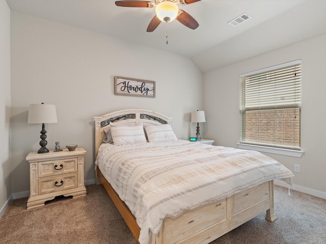 bedroom with baseboards, visible vents, ceiling fan, vaulted ceiling, and dark colored carpet