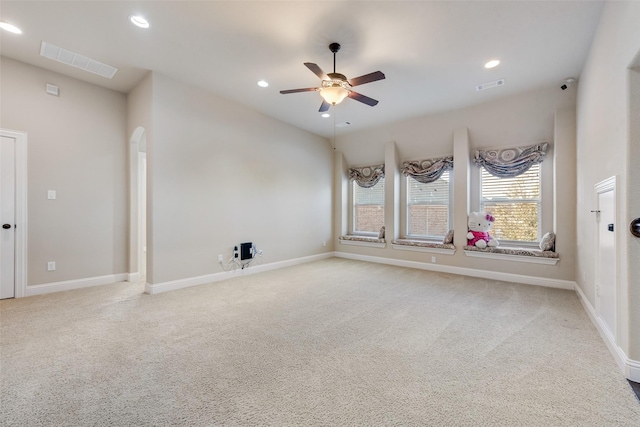 unfurnished room featuring light carpet, visible vents, and recessed lighting