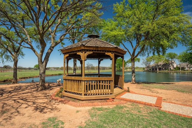 surrounding community featuring a water view and a gazebo