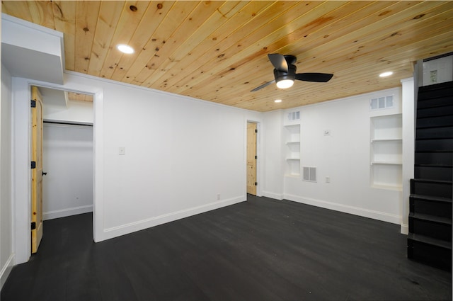 unfurnished bedroom featuring baseboards, visible vents, and dark wood finished floors