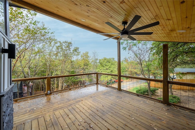 wooden deck featuring a ceiling fan