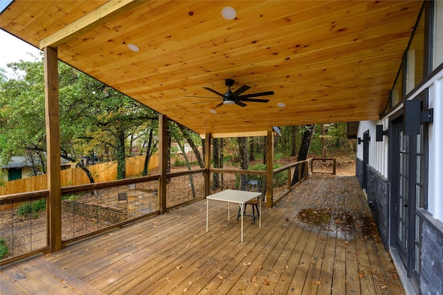 wooden deck with fence and a ceiling fan