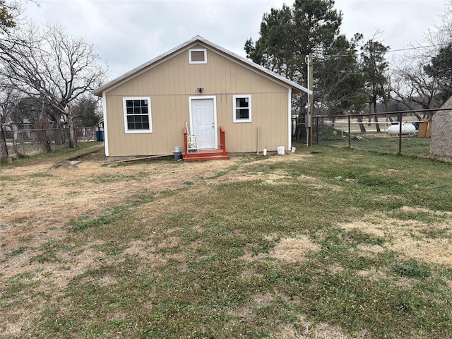 exterior space with an outbuilding and fence