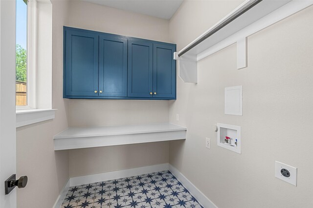 laundry area with light floors, hookup for a washing machine, cabinet space, hookup for an electric dryer, and baseboards