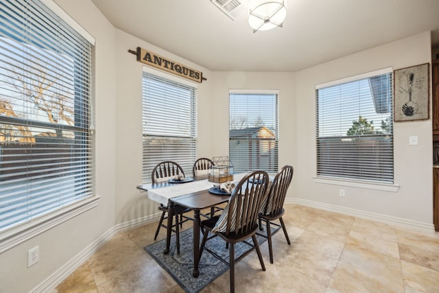 dining area featuring visible vents and baseboards