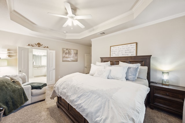 bedroom featuring carpet, a raised ceiling, visible vents, and crown molding