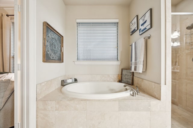 full bath with tiled shower and a garden tub