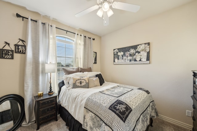 carpeted bedroom featuring ceiling fan and baseboards