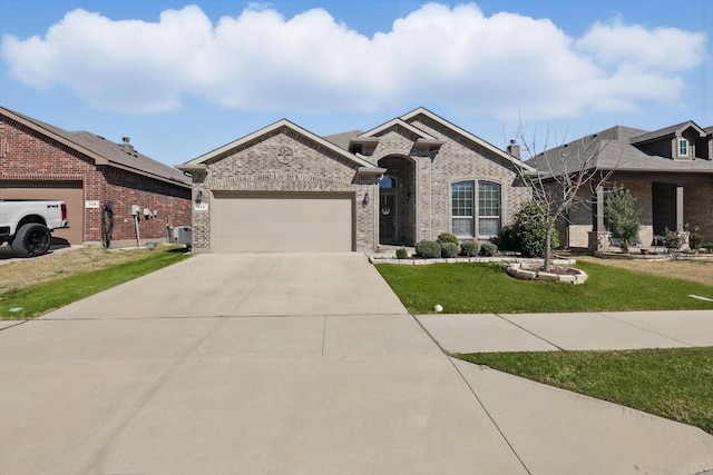 view of front of home with a front yard, concrete driveway, brick siding, and an attached garage