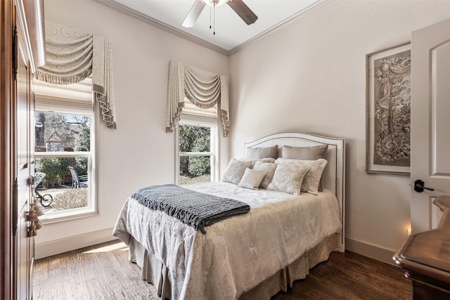 bedroom with ceiling fan, ornamental molding, wood finished floors, and baseboards