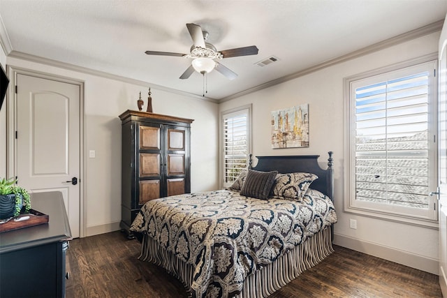 bedroom with dark wood-type flooring, a ceiling fan, visible vents, baseboards, and ornamental molding