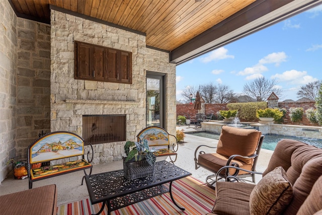 view of patio / terrace featuring an outdoor living space with a fireplace