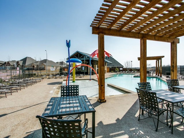 2404 Senepol Way, Fort Worth, TX 76131 - community pool with a pergola, a patio, and outdoor dining area